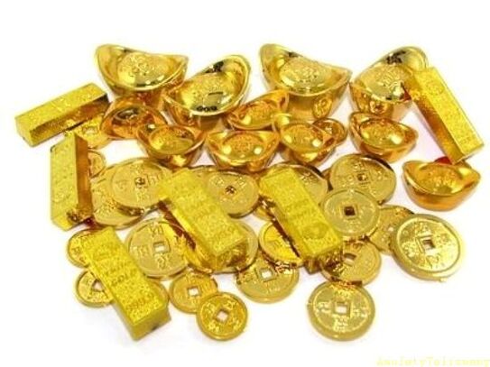 золоті зливки та монети як амулети удачі